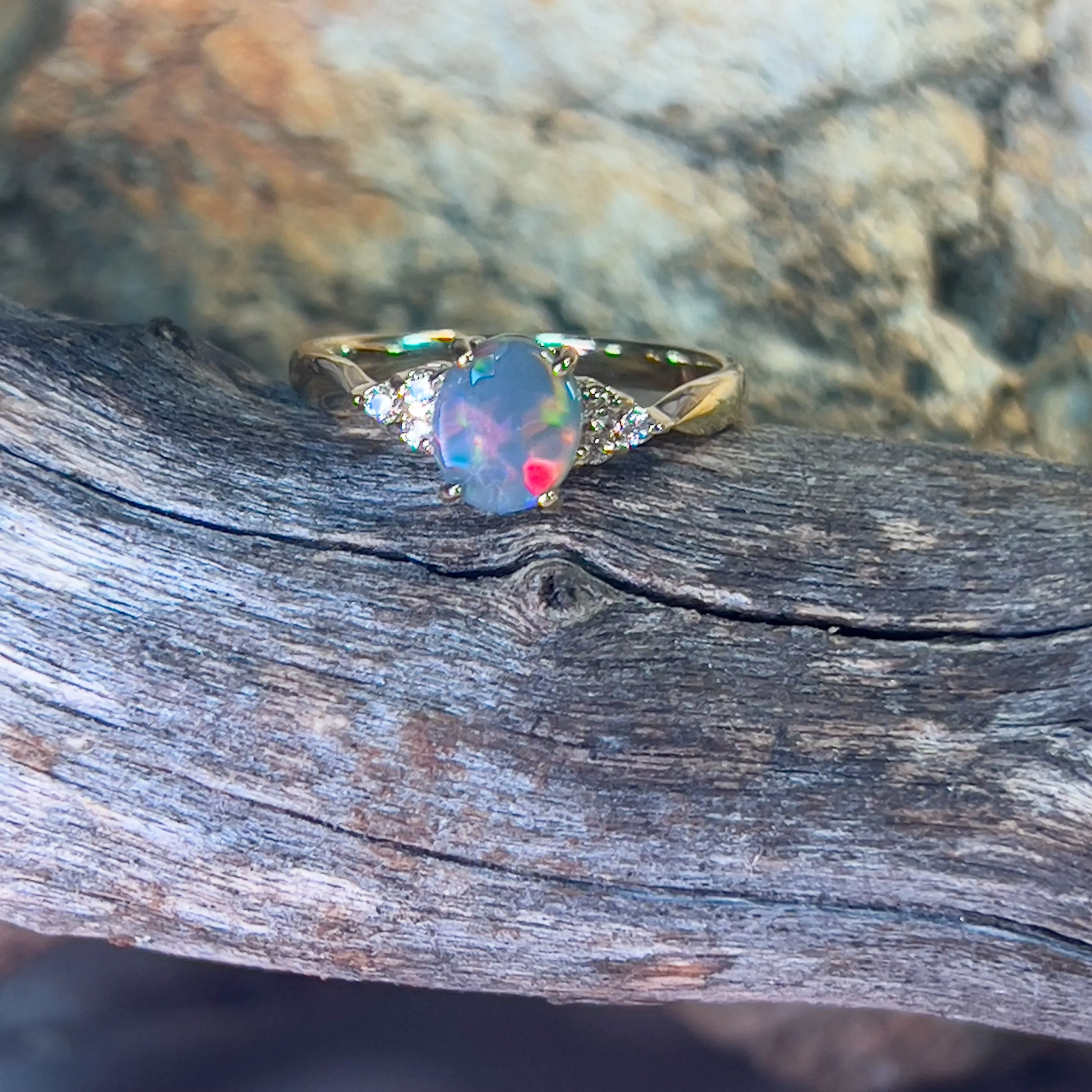 18kt Yellow Gold 1 Black Opal and 6 diamond ring