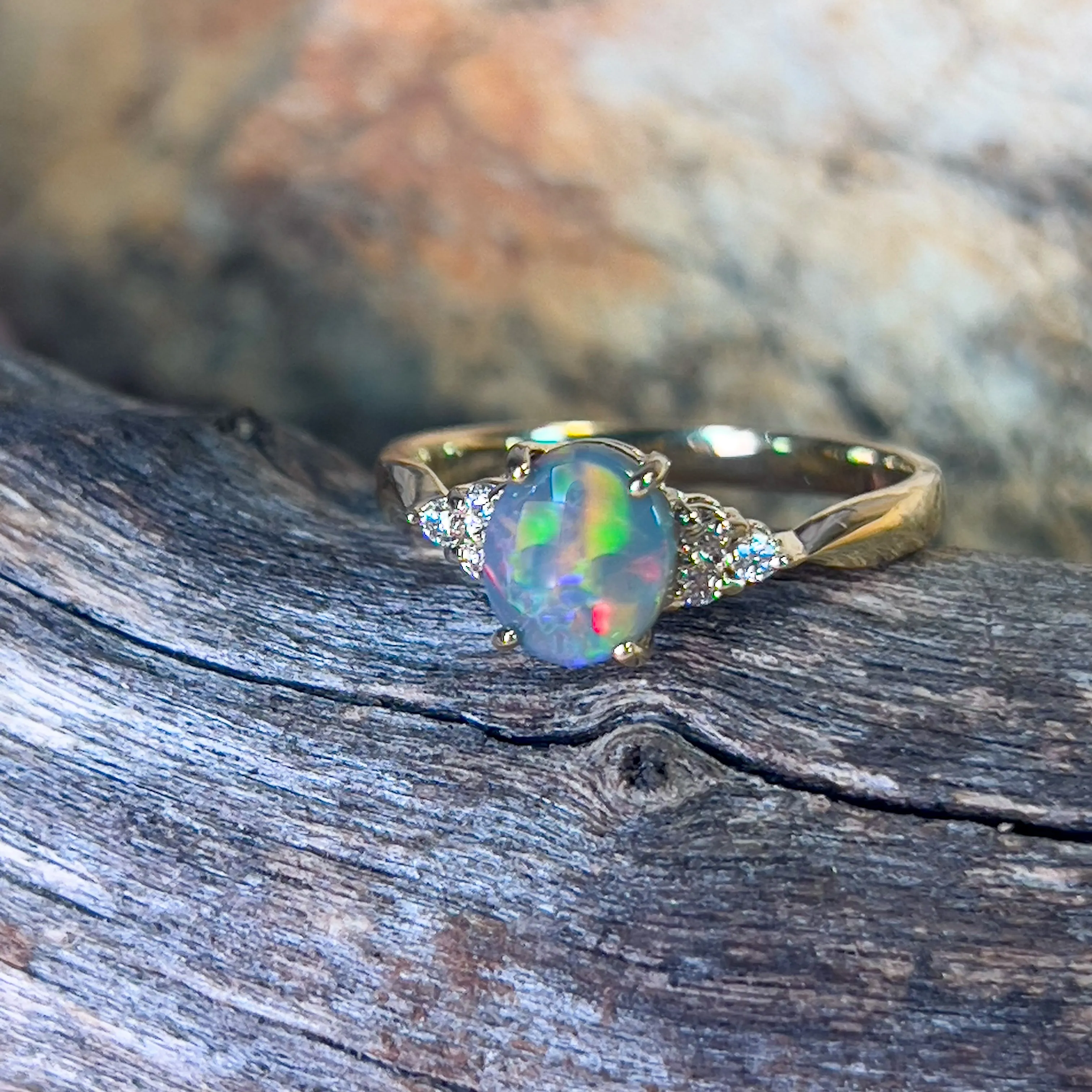 18kt Yellow Gold 1 Black Opal and 6 diamond ring