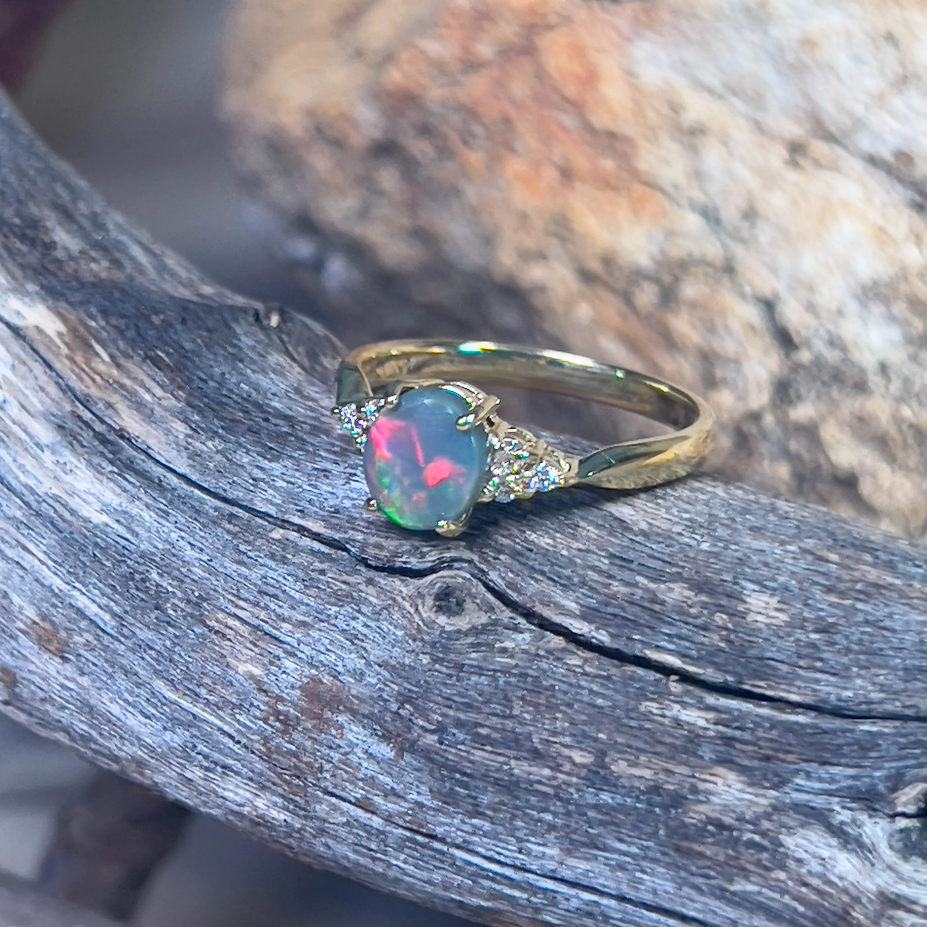 18kt Yellow Gold 1 Black Opal and 6 diamond ring