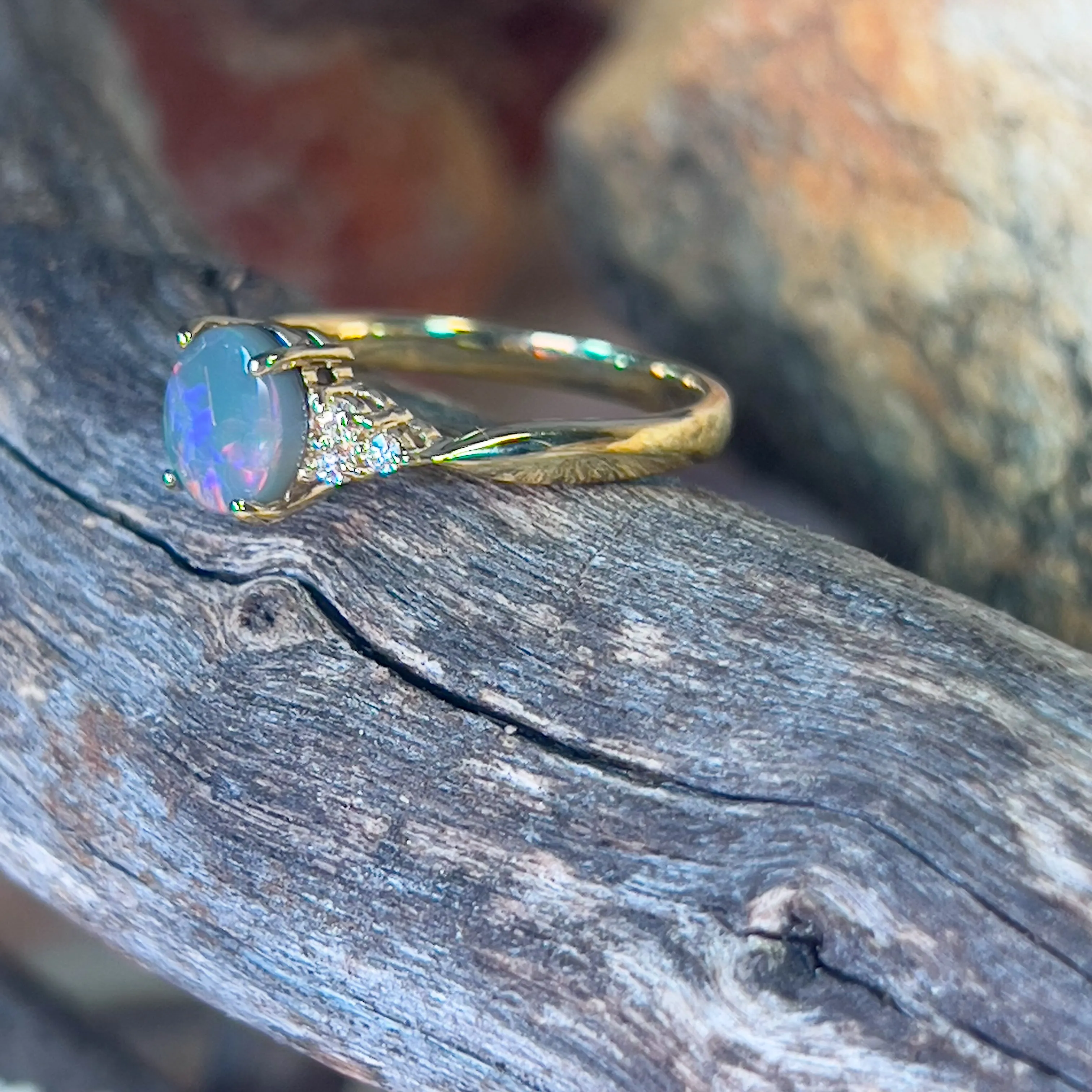 18kt Yellow Gold 1 Black Opal and 6 diamond ring