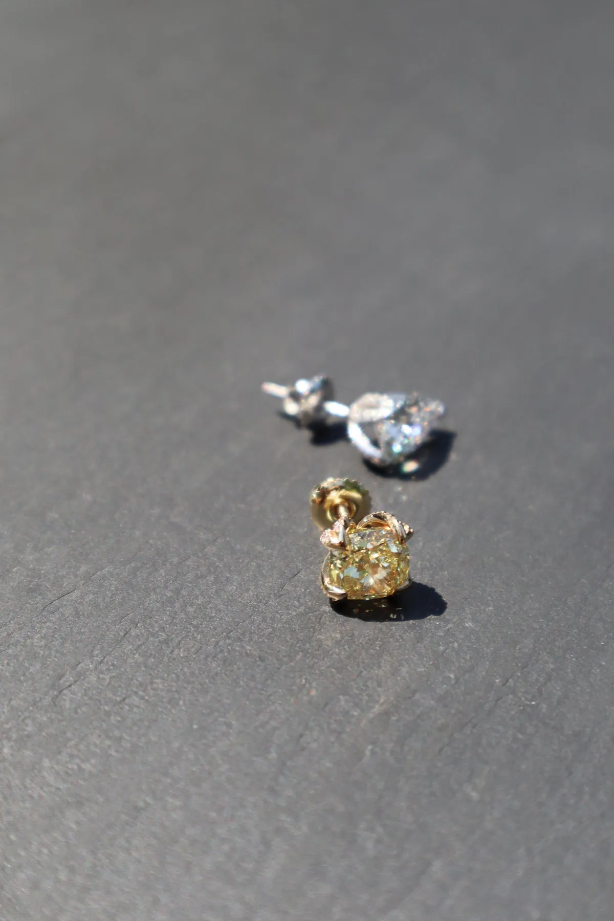 2.15 CT Luxurious Mismatched Earrings: Cushion-Cut Yellow Fancy Diamond and Pear-Shaped White Diamond