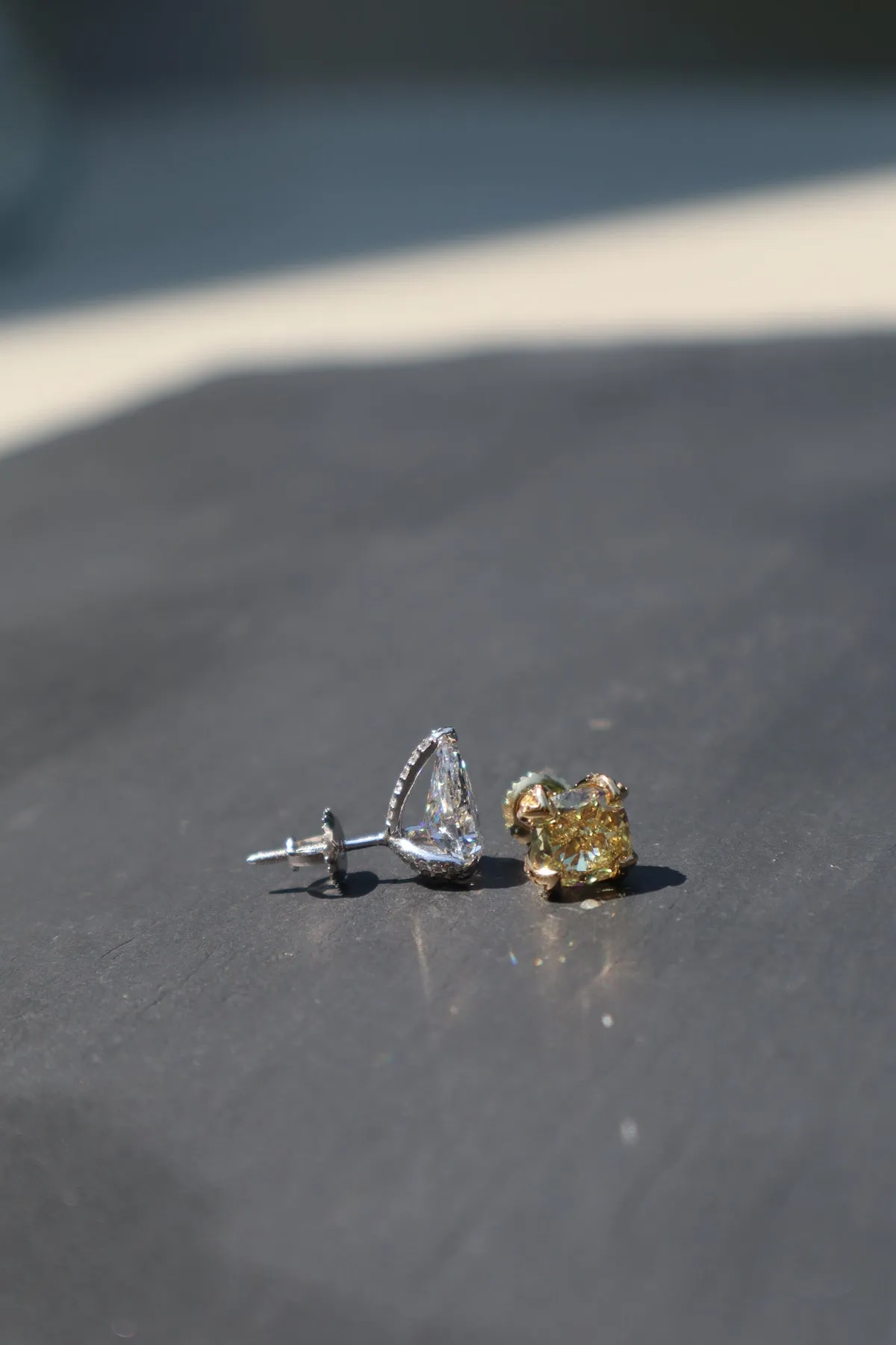 2.15 CT Luxurious Mismatched Earrings: Cushion-Cut Yellow Fancy Diamond and Pear-Shaped White Diamond