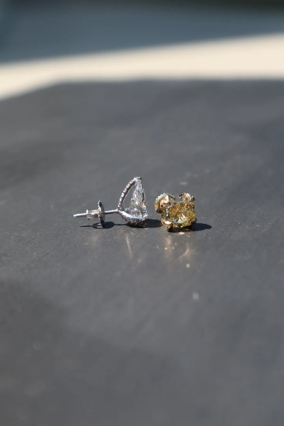 2.15 CT Luxurious Mismatched Earrings: Cushion-Cut Yellow Fancy Diamond and Pear-Shaped White Diamond